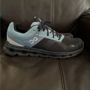 On Running Men’s Athletic Shoe in Black and Light Blue